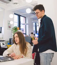 Developers collaborating on custom software development